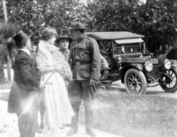 Motion picture scene, 1916. Harry Naughton, Ethel Burton, and unidentified actors. Unable to tell which individual is which.