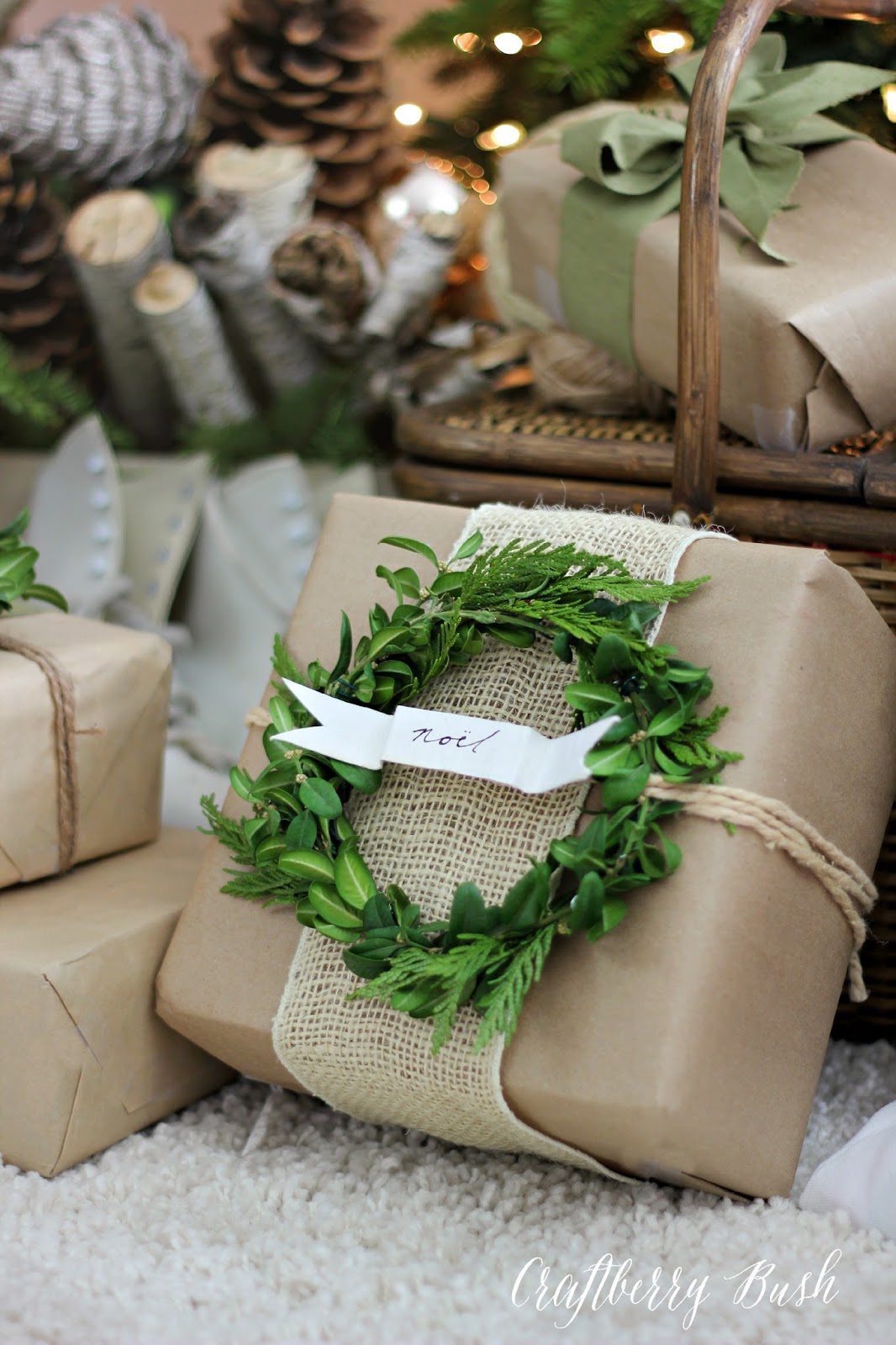 Package wrapped in kraft paper and burlap with a boxwood wreath gift tag....beautiful and neutral wrapping from Craftberry Bush | Friday Christmas Favorites at www.andersonandgrant.com