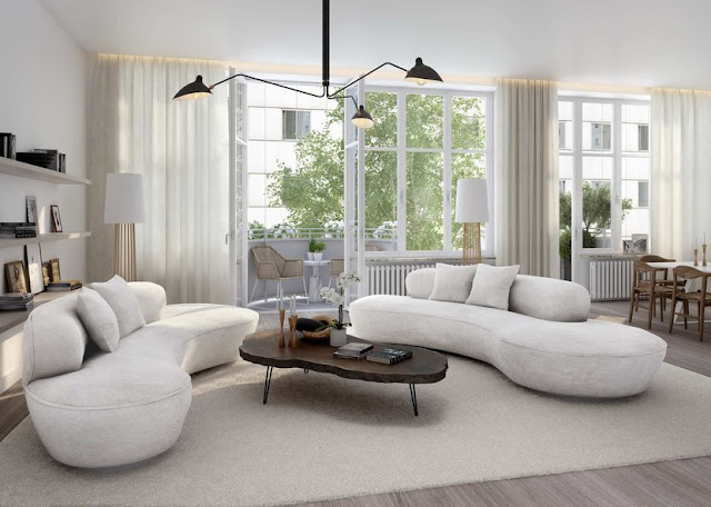 Stilvolle Wohnung in Stockholm Im Wohnzimmer stehen sich zwei große weiße Sofa gegenüber