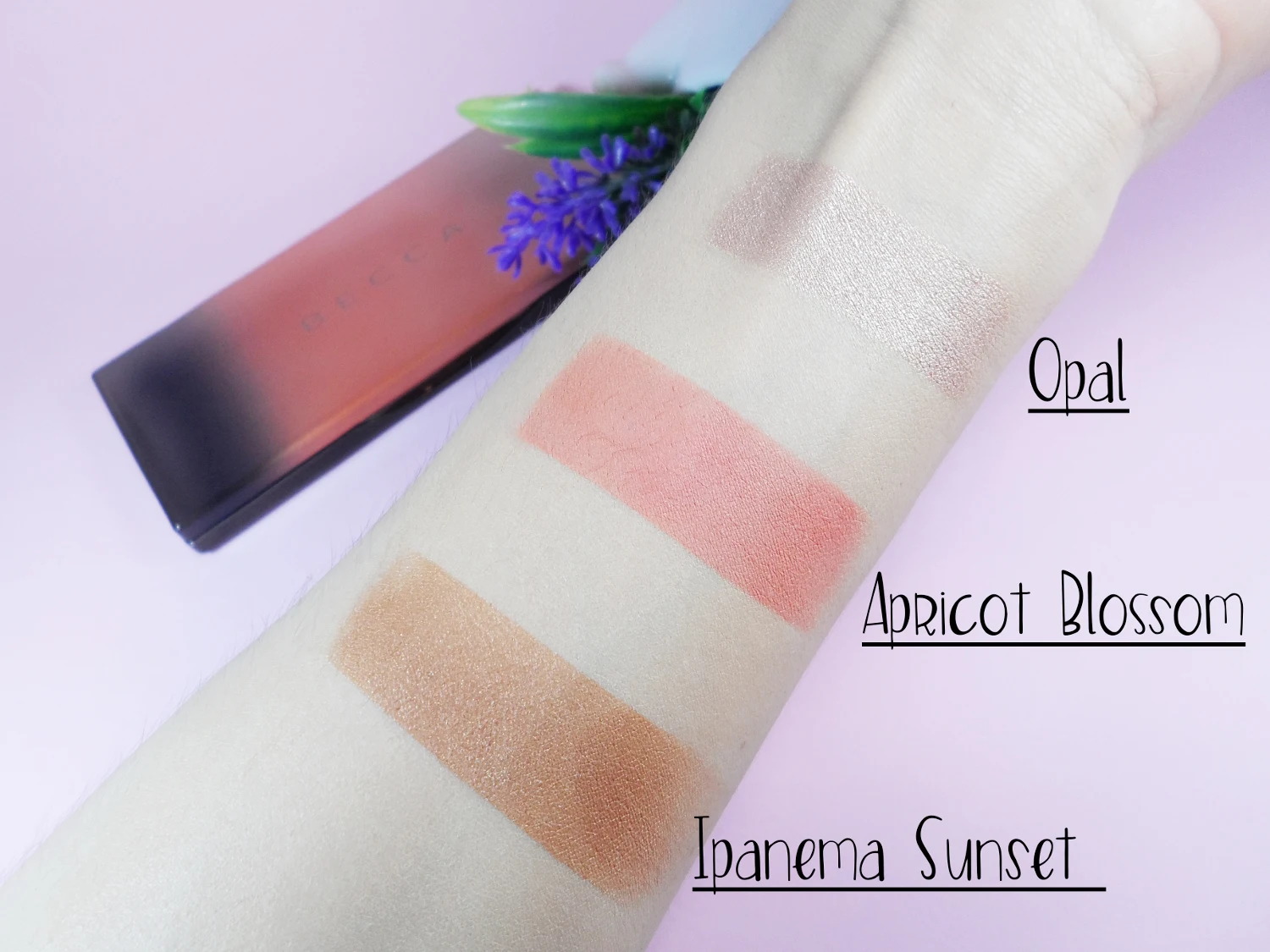close-up swatches of makeup contouring palette by Becca Cosmetics on a light skin