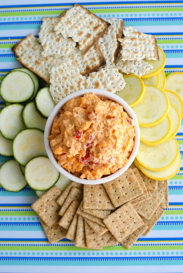 With the addition of some smoked paprika and a splash of beer, this Drunken Pimento Cheese is a delicious twist on the classic cheese spread that is great served with crackers, veggies, or as a sandwich spread.  You will want to eat it with everything!