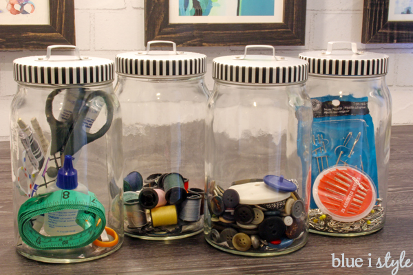 Simple and smart laundry closet organizing hacks! Use glass canisters for extra buttons, thread, needles, and other mending and sewing kit essentials. Laundry room sewing and mending