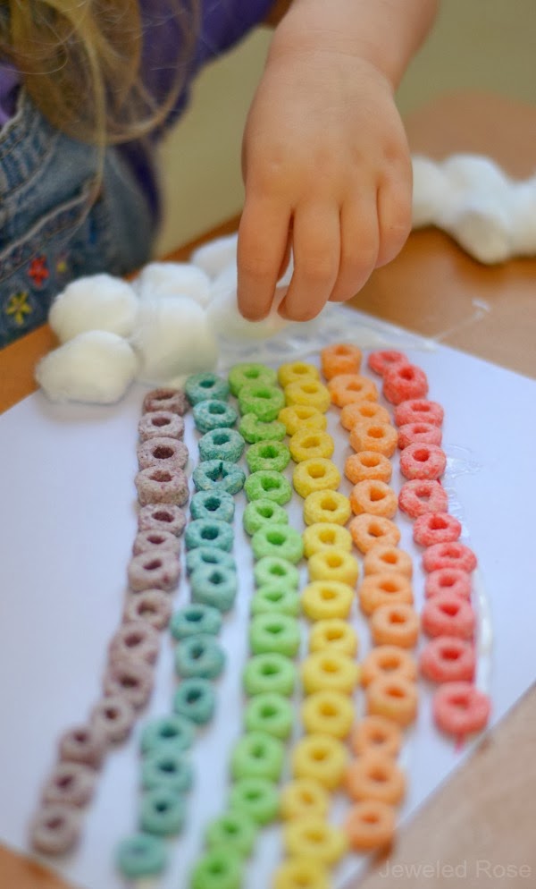 I gave Rosie and Jewel a large bowl of Fruit Loops, and they had lots of fun sorting the colors and placing them onto the rainbow lines