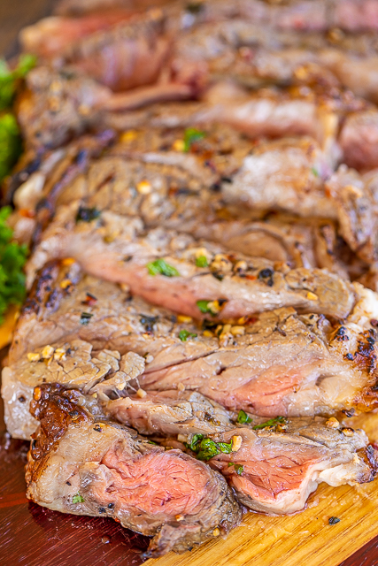 Air Fryer Ribeyes - so easy and taste fantastic!! Ready in minutes! We marinated the steaks in a simple Greek marinade of olive oil, lemon juice, garlic, oregano, salt, pepper and red pepper flakes. Marinate a few hours to overnight. Ready to eat in under 10 minutes! #steak #airfryer #steakmarinade Sliced Ribeye steak