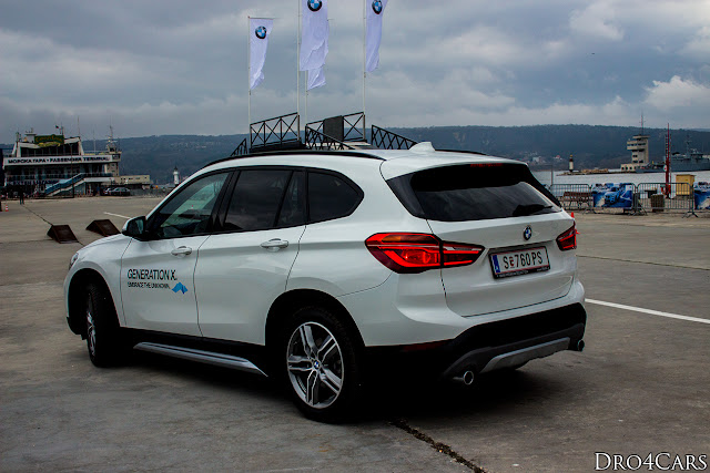 2016 BMW X1 white model left and rear sides