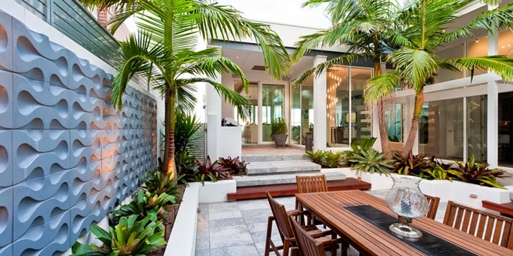 Terrace furniture in Coastal Oasis landscape project by Urban Exotic