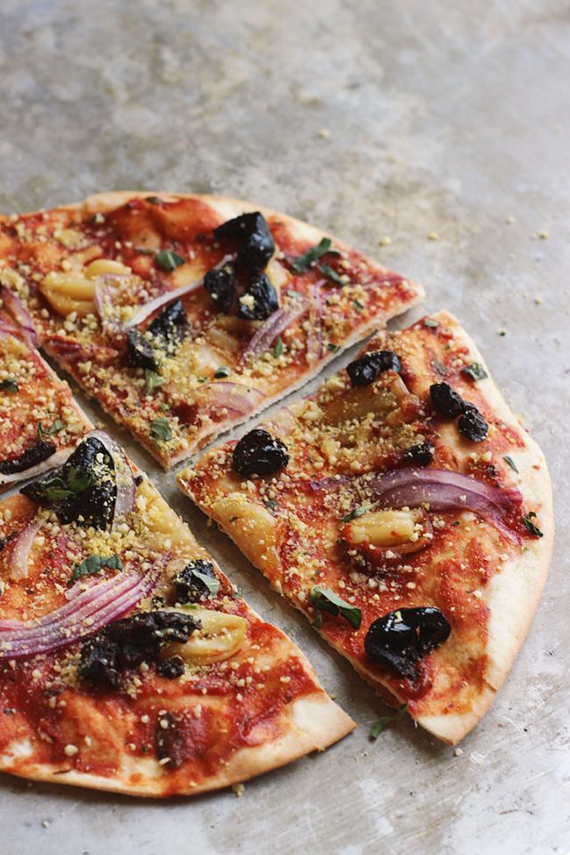 Oil-cured Black Olive + Smashed Garlic Pizza with Herby Oregano ‘Parm’ recipe by With Food and Love 