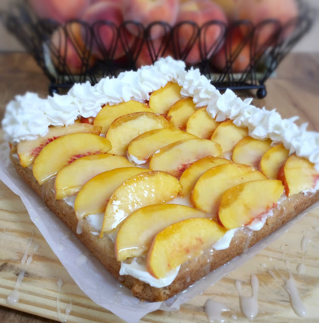 peach cheesecake bars with whipped cream rosettes