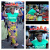Beauty queen hawks tomatoes at the market for birthday photoshoot