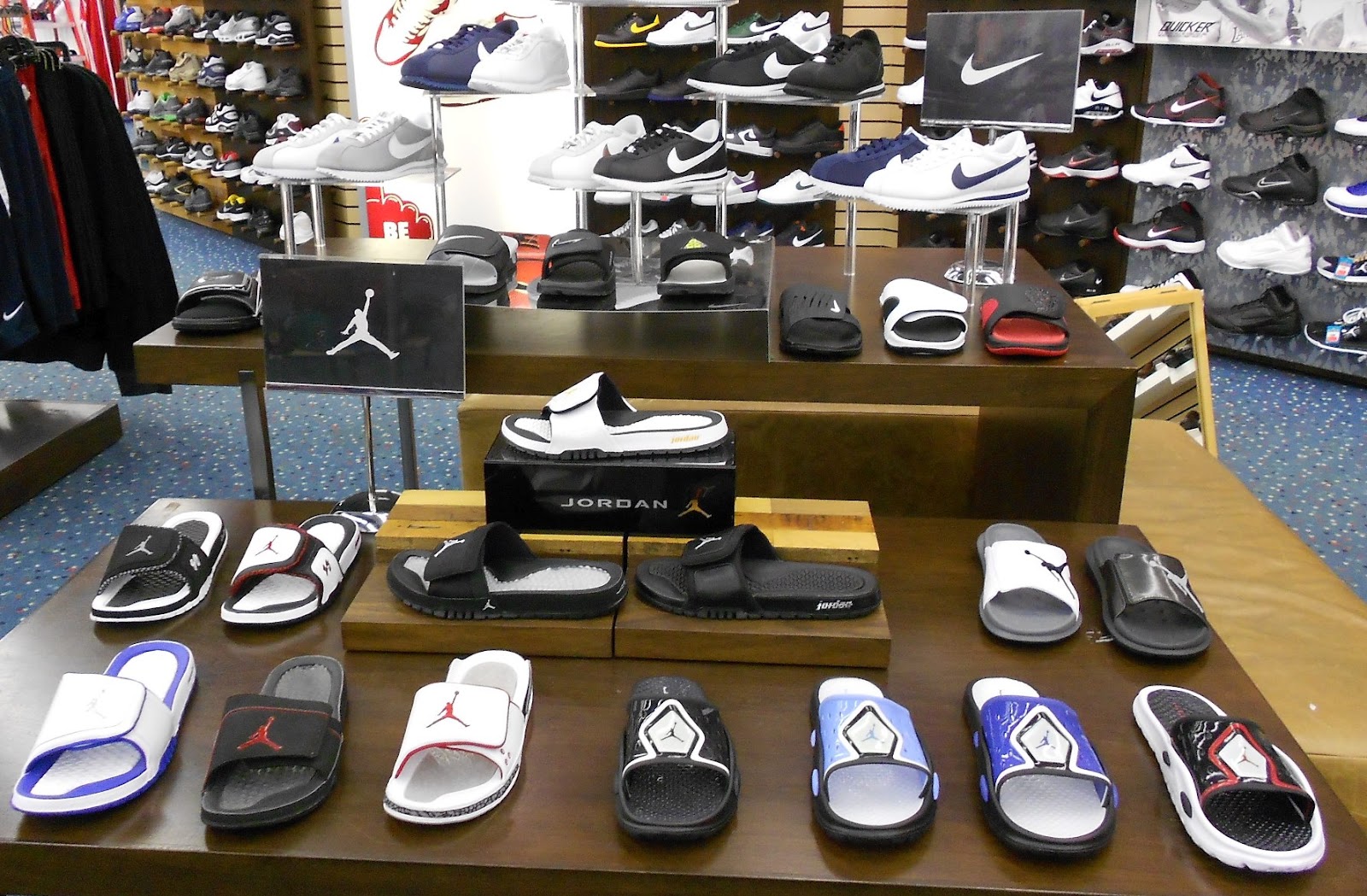 Mr. Alan's...since 1974 Jordan Slides and Nike Elite Socks at Mr. Alan's!