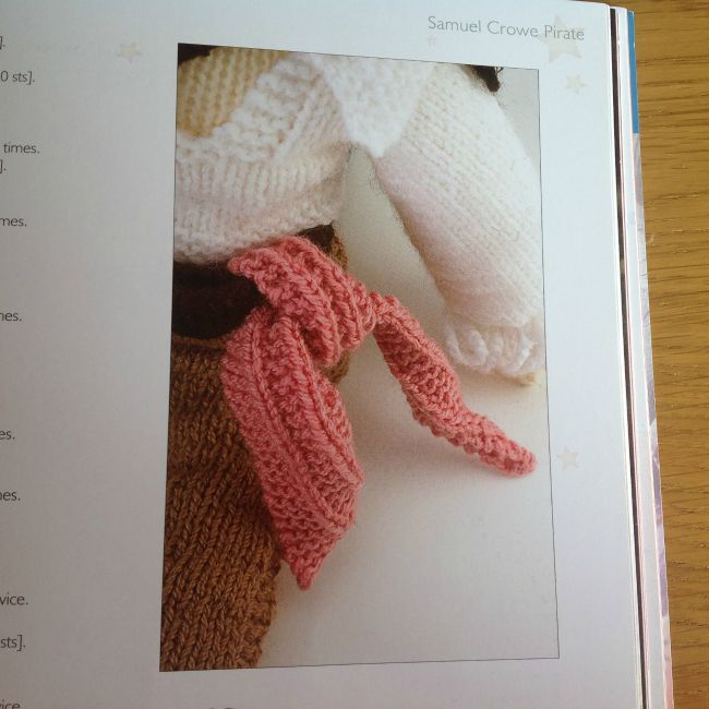Picture of part of knitted doll showing scarf