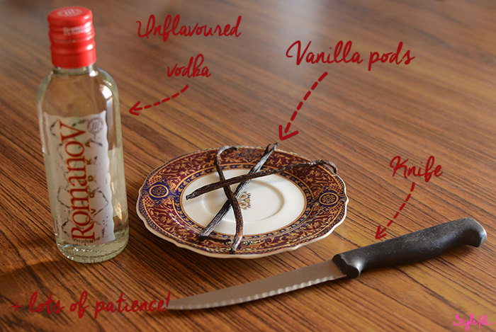 An image of vodka, a knife and vanilla beans isolated on a wooden table to make a do it yourself project of how to make vanilla extract at home