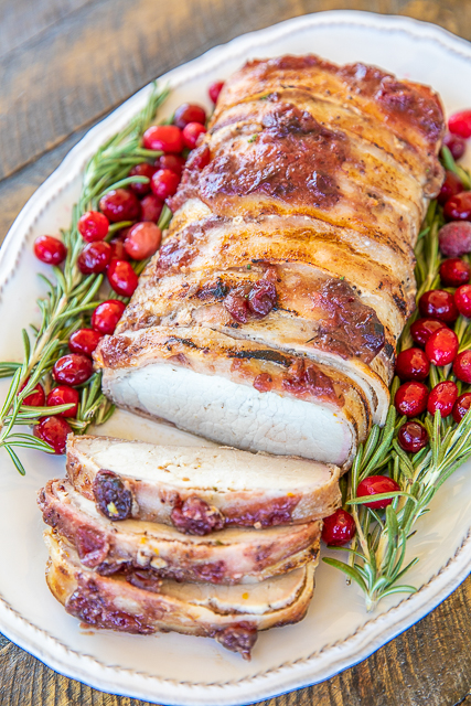 Slow Cooker Cranberry Orange Pork Loin - Holiday Pork Loin - a great alternative to turkey at the holidays! SO tender and delicious! Everyone cleaned their plates and went back for seconds!!! Pork loin rubbed in brown sugar, garlic, rosemary, salt and pepper then wrapped in bacon and topped with cranberry sauce, orange juice, orange zest and dijon mustard. This is seriously delicious!!! Grab an Iowa Pork produced pork loin and give this a try for your holiday meal! #slowcooker #crockpot #pork Slow Cooker Cranberry Orange Pork Loin - Holiday Pork Loin - a great alternative to turkey at the holidays! SO tender and delicious! Everyone cleaned their plates and went back for seconds!!! Pork loin rubbed in brown sugar, garlic, rosemary, salt and pepper then wrapped in bacon and topped with cranberry sauce, orange juice, orange zest and dijon mustard. This is seriously delicious!!! Grab an Iowa Pork produced pork loin and give this a try for your holiday meal! #slowcooker #crockpot #pork