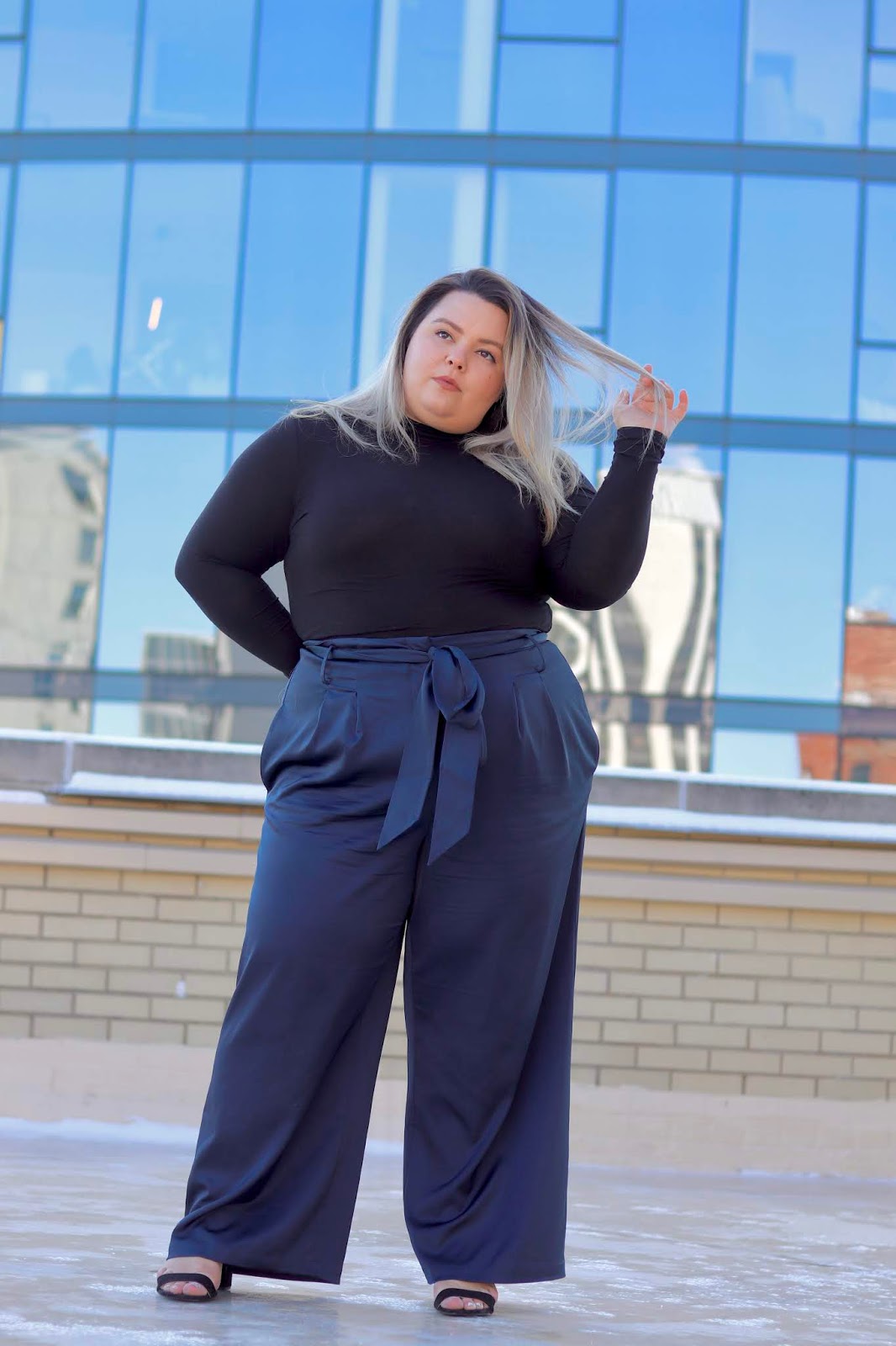 Chicago Plus Size Petite Fashion Blogger, influencer, YouTuber, and model Natalie Craig, of Natalie in the City, reviews Universal Standard's plus size petite wide leg satin pants and turtle necks.