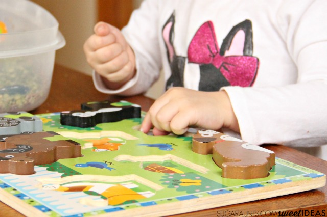 Work on fine motor skills like in-hand manipulation with a wooden letter puzzle. You can do this with any puzzle and work on things like letter identification, letter formation, numbers, animals, or shapes. Perfect for preschool or toddler activities.
