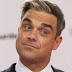Robbie Williams: "Me volví un neurótico con mi lugar en las listas de ventas"