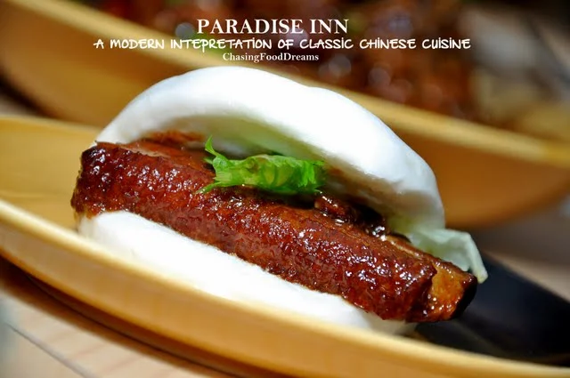 A brightly lit restaurant interior with diners enjoying healthy-looking meals.