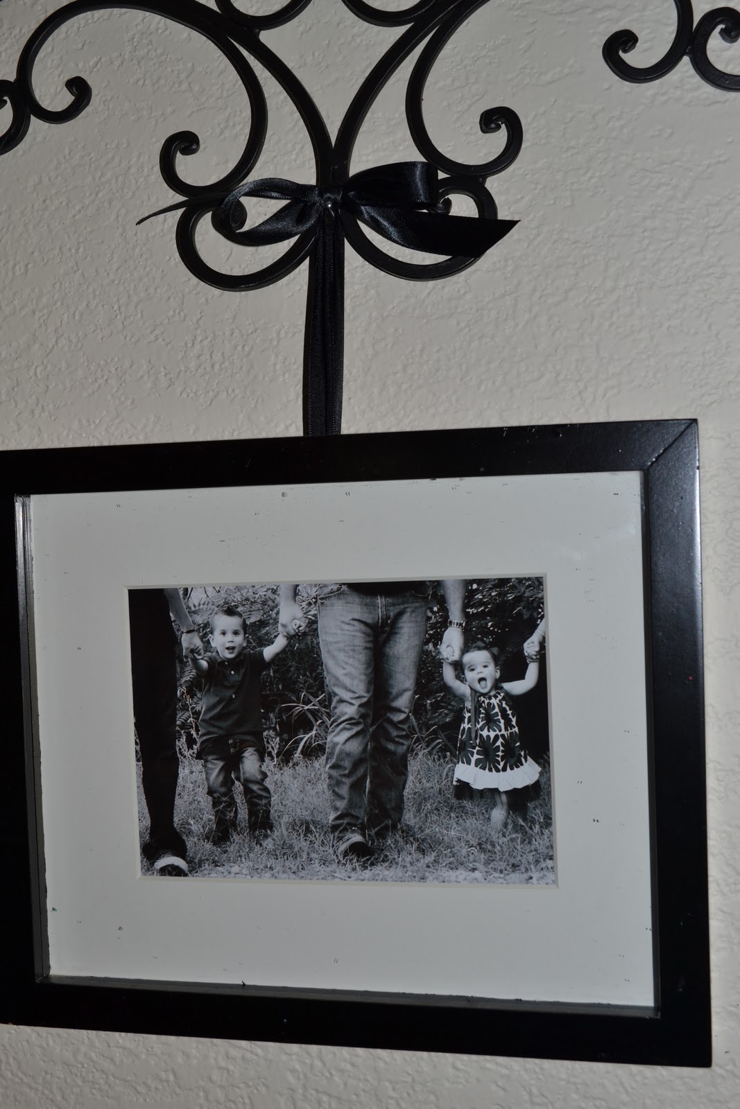 Therapy. Everyone needs some. DIY Wrought Iron Picture Hanger with