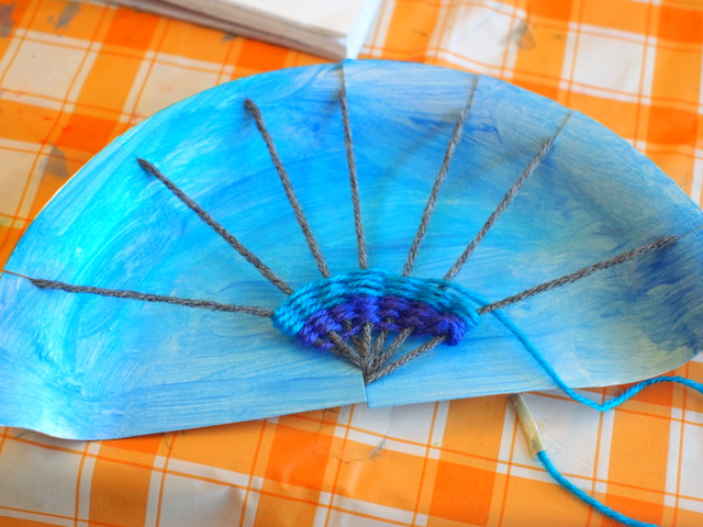 Weave a rainbow! Fun Rainbow Paper Plate Weaving Art and Craft Project for kids