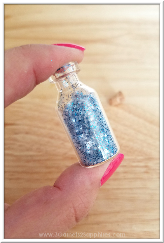 DIY Fairy Dust Bottles Craft How-To  |  3 Garnets & 2 Sapphires