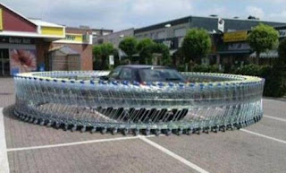 Car ring-fenced by shopping carts/trolleys