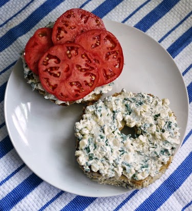 corn basil schmear on everything bagel with caspian pink tomato