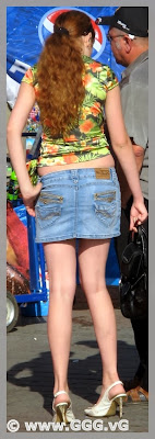 Girl in jean mini-skirt on the street  