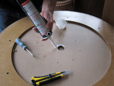 Crokinole - Applying the glue to the reverse of the inner board for the central well cap