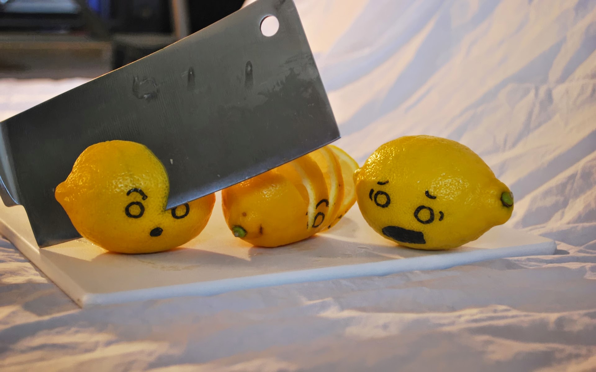 Lemons being chopped by a knife