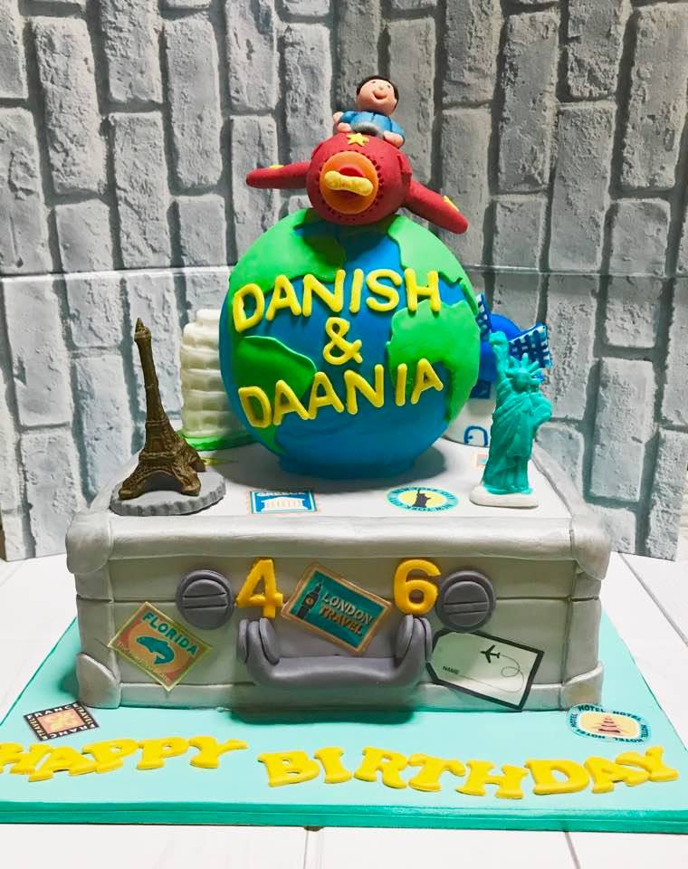 Izah's Kitchen Round the World Themed cake and cookies. Halal cakes