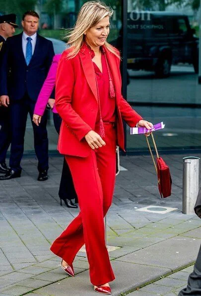 Queen Maxima wore Claes Iversen LaPerm classic blazer and Lykoi trousers and Korat silk blouse. she carries Chanel red bag