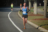 Halfway through the Turkey Trot 15K, Caleb Carmichael (2nd, 51:30) runs in second place. Caleb Carmichael