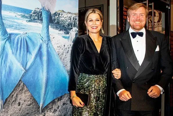 Queen Maxima wore a velvet top and metallic trousers as she joins husband at a film premiere in Amsterdam