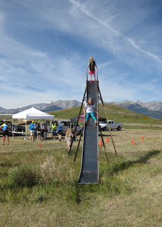 Two girls on the giant slide in Sedan, Montana