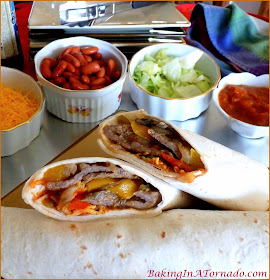 Crockpot Beef Soft Tacos, cook the meat and vegetables in the crockpot with seasonings, then at dinnertime everyone can customize with their favorite toppings | Recipe developed by www.BakingInATornado.com | #recipe #crockpot #slowcooker #dinner 