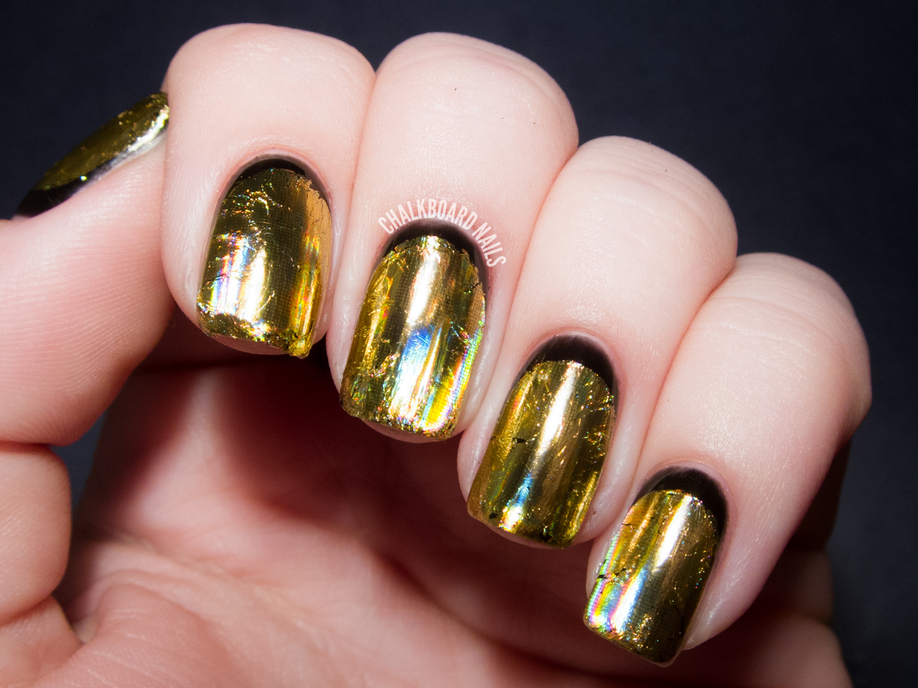 nail art design in black and gold