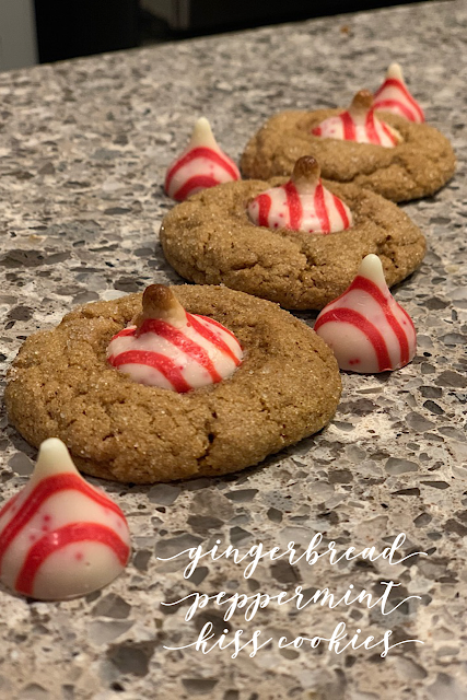 Sitting on the countertop are three gingerbread peppermint cookies and kisses and three kisses by themselves.