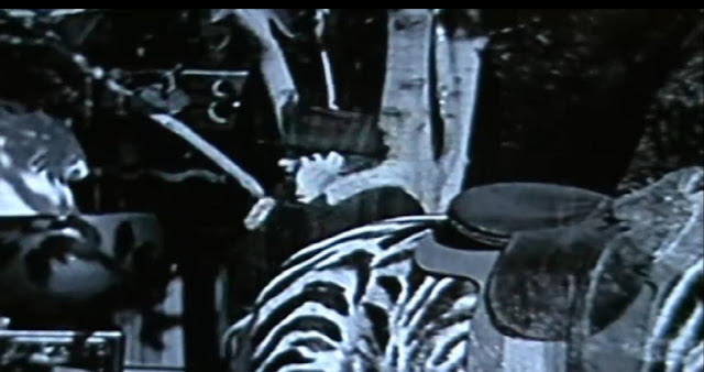 Woman time traveller caught talking in to a cell phone in an old black and white film. Woman time traveller caught talking in to a cell phone in an old black and white film.