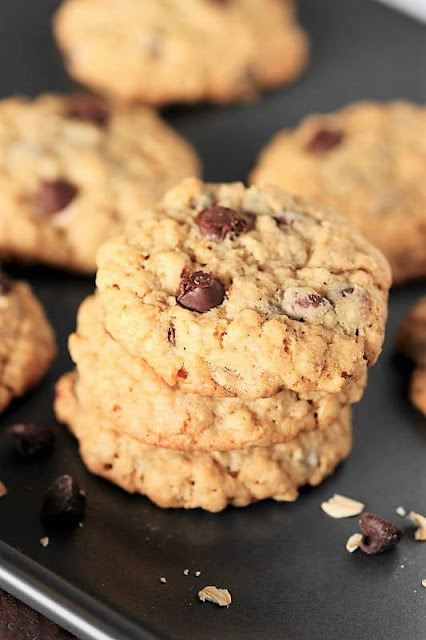 Chewy Oatmeal Chocolate Chip Cookies image ~ When it comes to enjoying everyone's favorite oatmeal cookies, hold the raisins and mix in a hearty dose of chocolate instead!