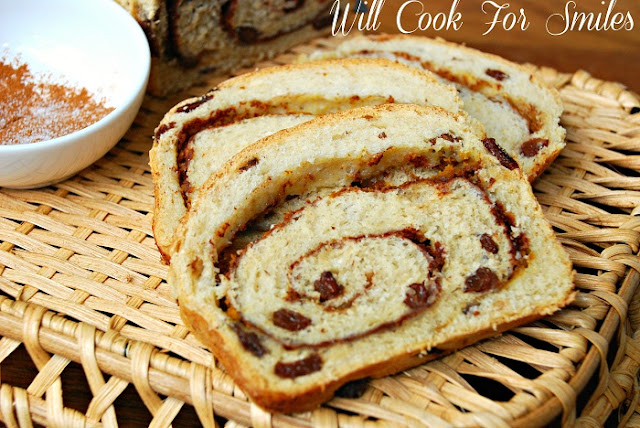 Pumpkin Spice Swirl Bread slices with the rest of the loaf and bowl of spice 