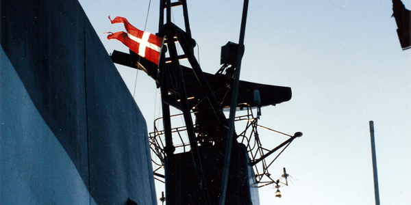 Dannebrog (Danish flag) waving in the wind on the corvette Peter Tordenskiold