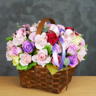 mother's day flower basket with blue ribbons