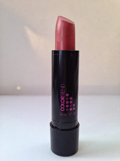A tube of pink lipstick inside a black avon case