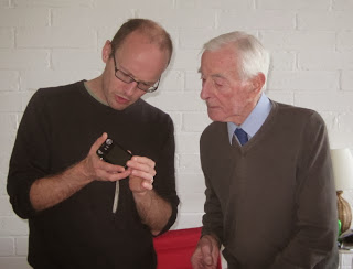 B and my Dad looking at a camera