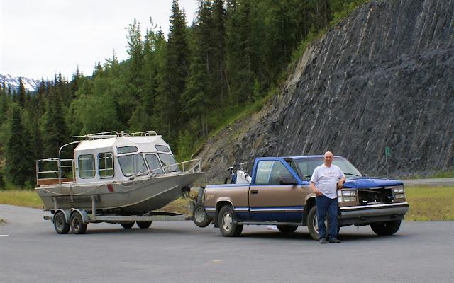 Our boat and damage truck from hitting a moose on the road