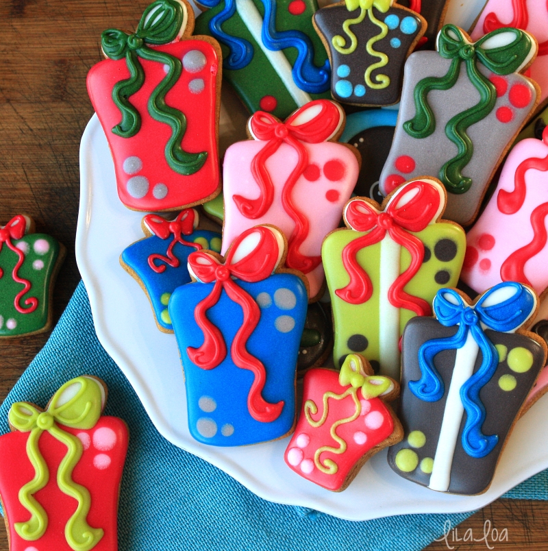 Cute and fun brightly colored gift and present decorated sugar cookies with bows