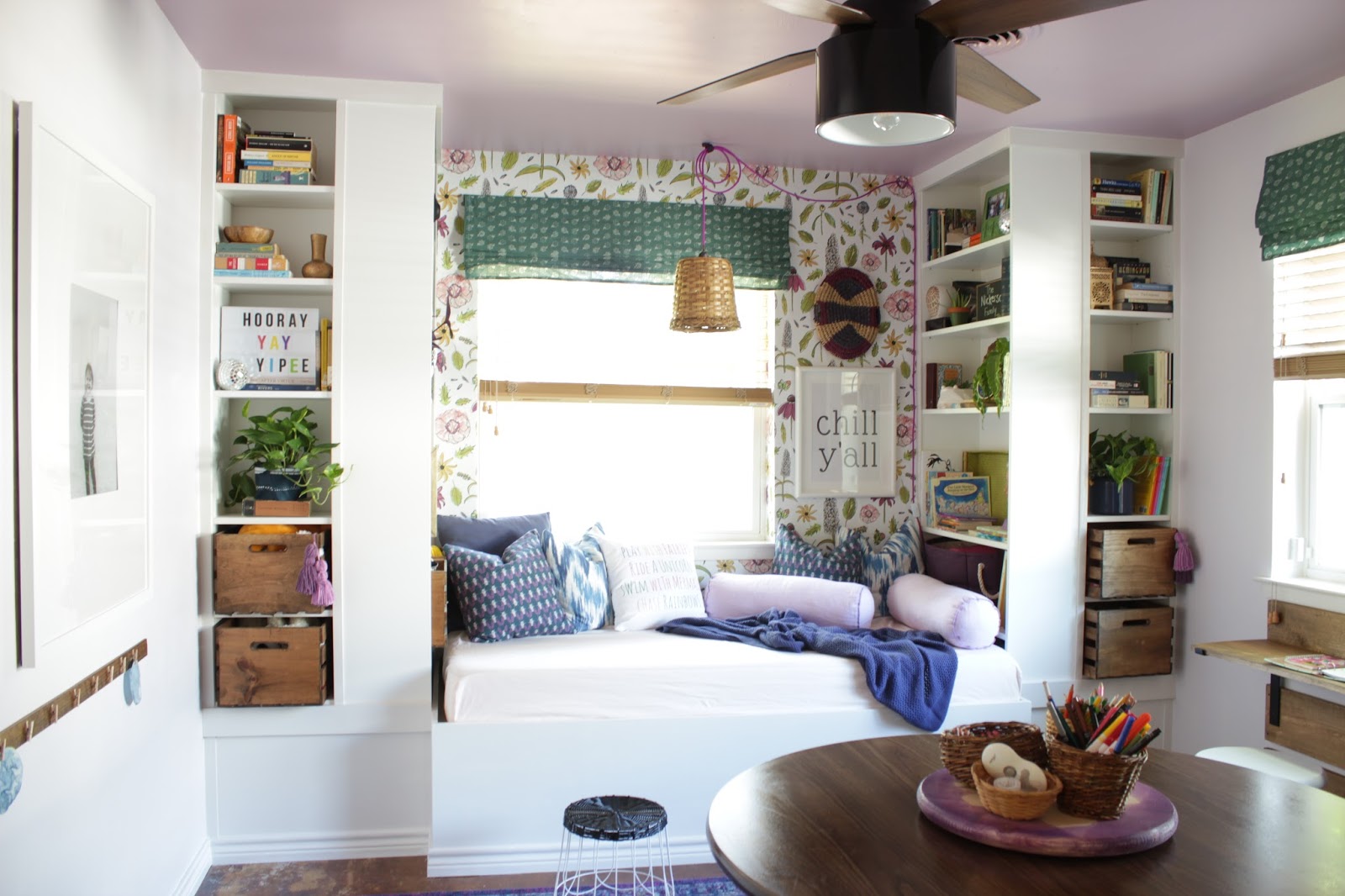 We transformed this space with built ins using Ikea bookshelves. This daybed space is so versitile and provides so much storage. 