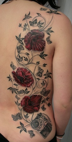 Tribal red flower tattoo with camera on back body 