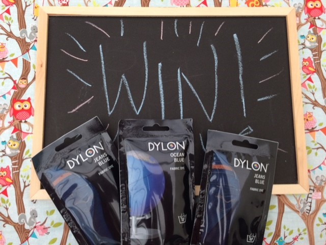 Three types of Dylon dye with a chalkboard with the words WIN written on it