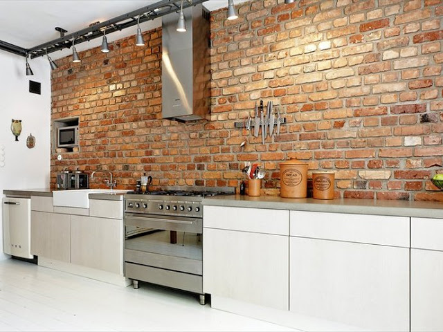 Decoração de cozinha com parede de tijolinho a vista